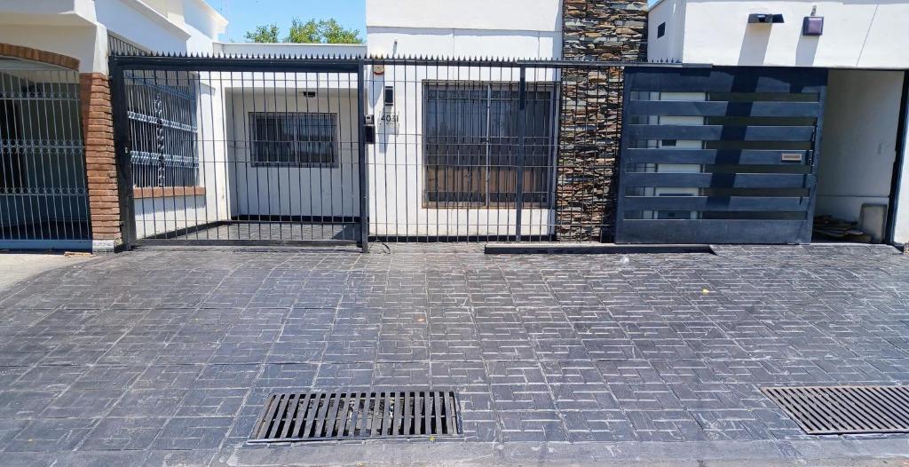 a gate in front of a building at Mendoza is life in Guaymallen