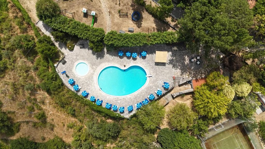 an aerial view of a large pool with blue water at Agriturismo Monte Sacro in Mattinata