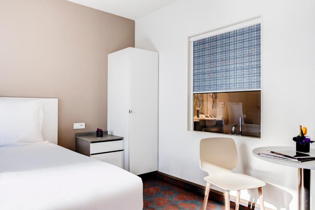 Postel nebo postele na pokoji v ubytování Hotel ParkSaône