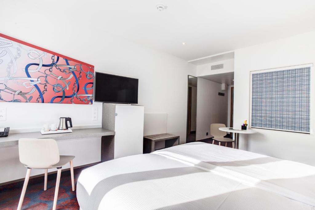 Postel nebo postele na pokoji v ubytování Hotel ParkSaône