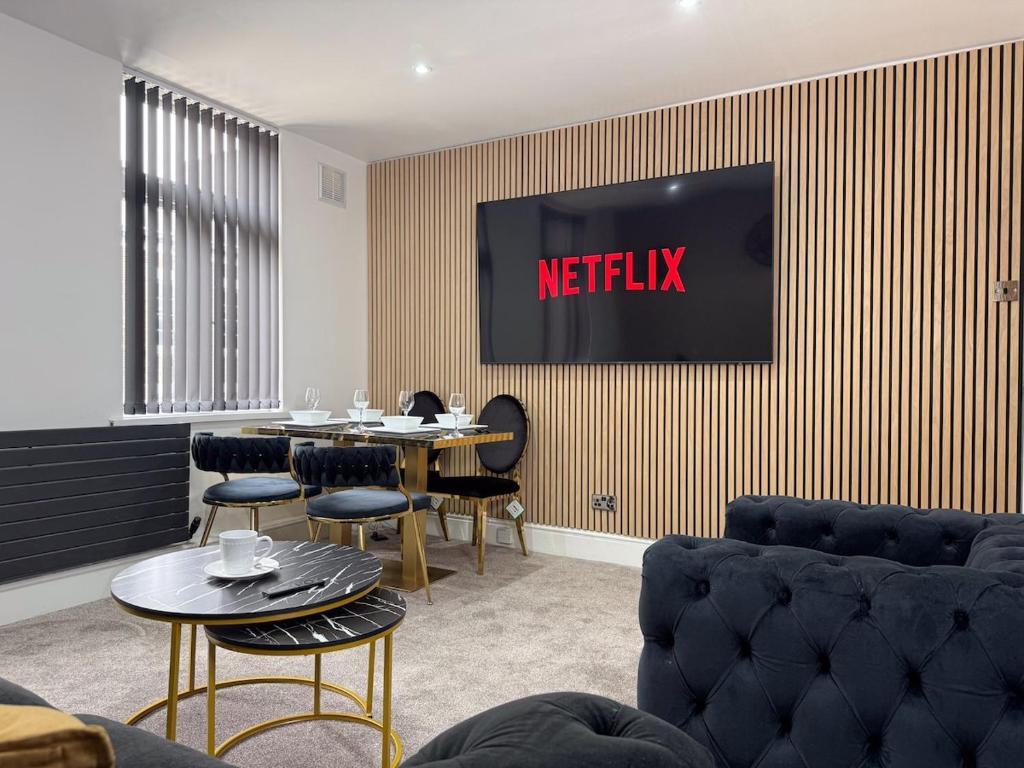 a waiting room with a netflix sign on the wall at Sunderland Central 2BR Apartments in Sunderland