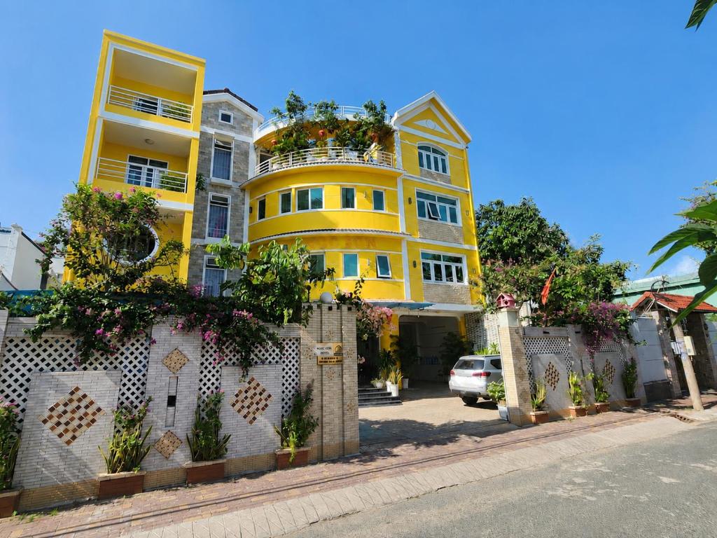 a yellow building on the side of a street at Ngoc Son Hotel in Bien Hoa