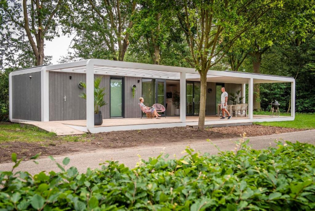 a small house with people inside of it at Forest Cube 2 persons #628 2 persoons in Maasbree