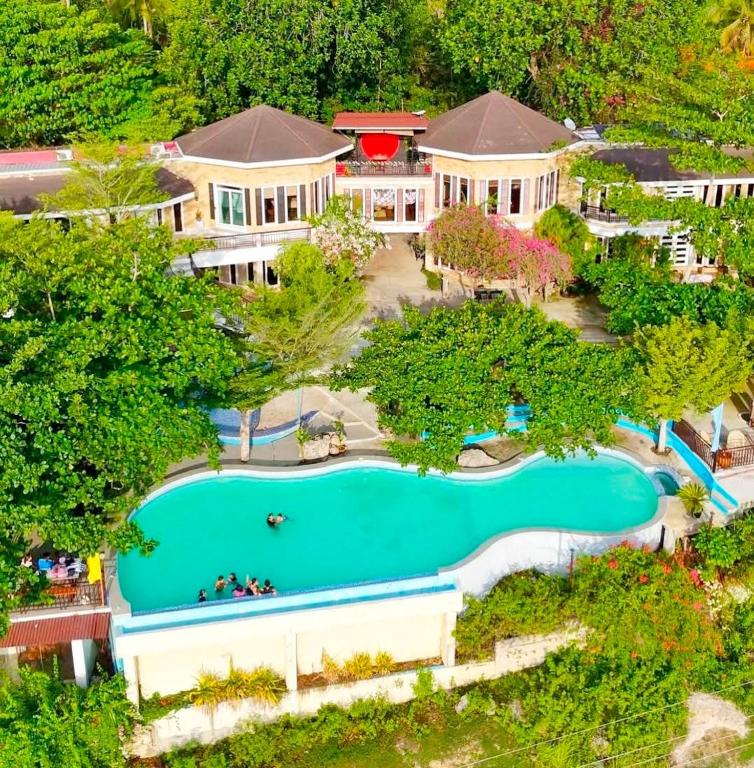 an aerial view of a large house with a swimming pool at Castle View Hotel Resort in Samal