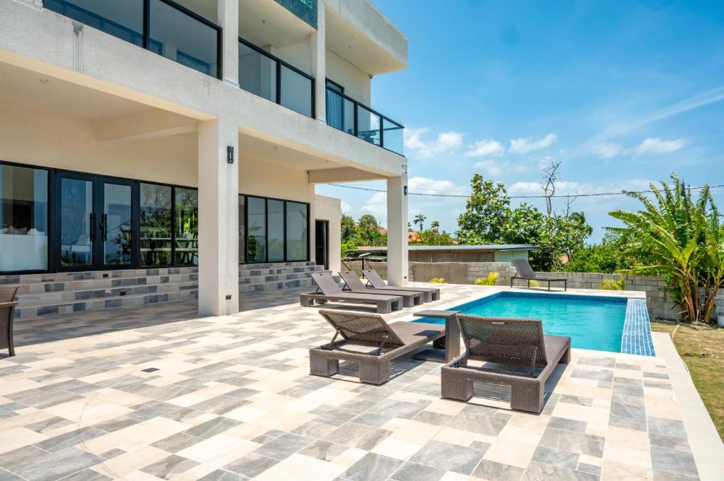 an image of a house with a swimming pool at Emotions by Ironshore in Montego Bay