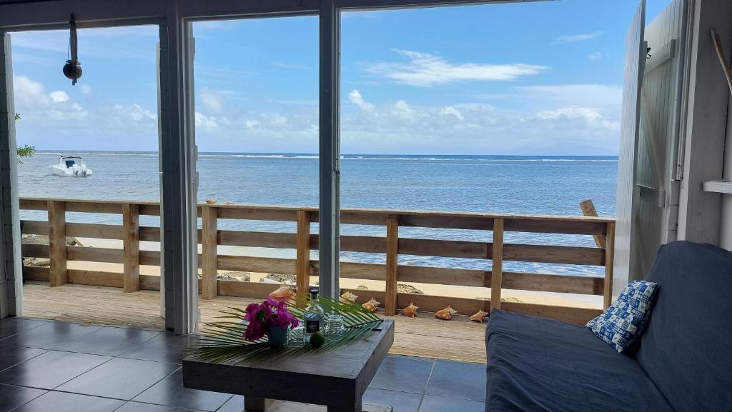 a living room with a view of the ocean at Case du pêcheur in Grand-Bourg