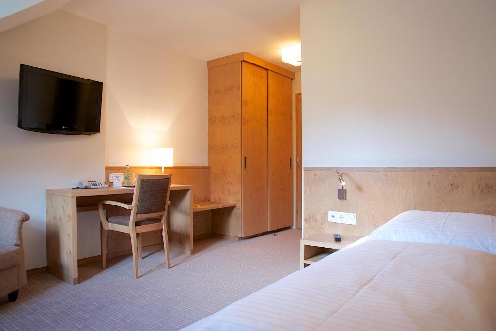 Postel nebo postele na pokoji v ubytování Hotel zur Mühle