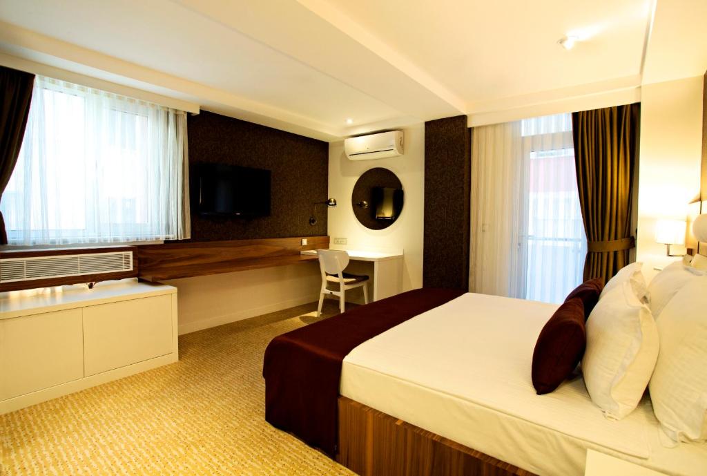 Postel nebo postele na pokoji v ubytování Endglory Hotel