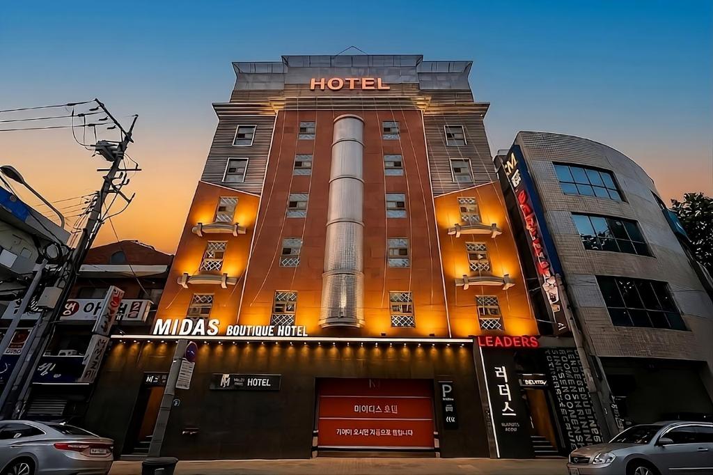 a hotel building with a space shuttle on it at Hotel Midas in Daegu