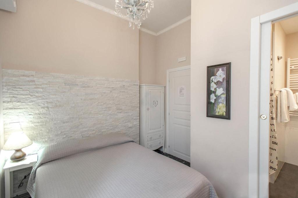 Postel nebo postele na pokoji v ubytování Hotel Masaccio