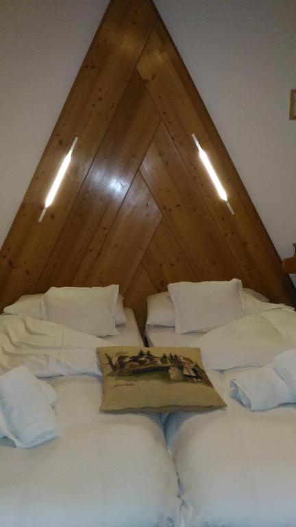 Postel nebo postele na pokoji v ubytování Hotel Capriolo