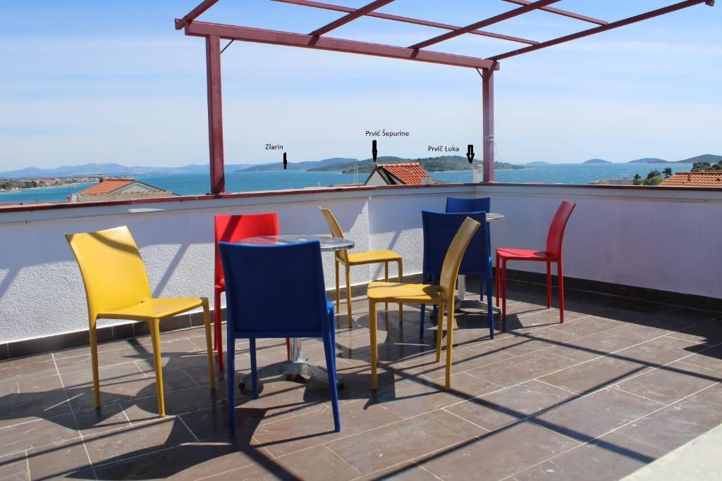 a group of chairs and tables on a roof at Lighthouse in Vodice