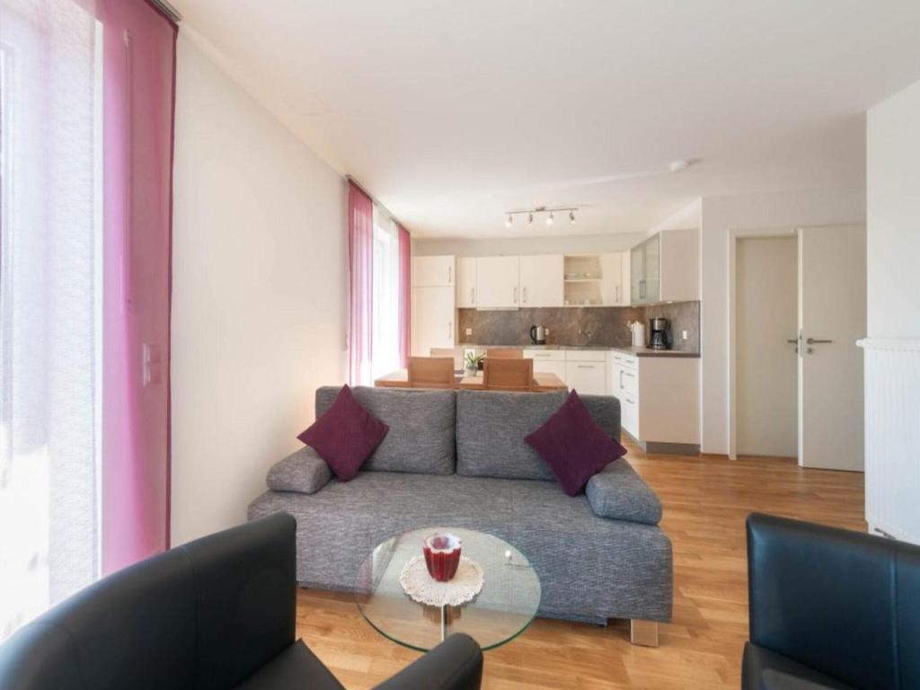 a living room with a couch and a table at Ferienwohnung Rohrhofer in Tiefenbach