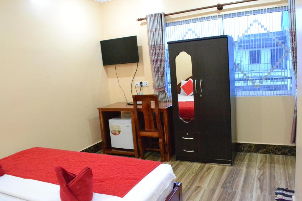 Postel nebo postele na pokoji v ubytování Capital Battambang Hotel