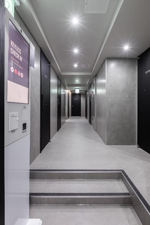 a corridor of an elevator in a building at VIA jongno in Seoul