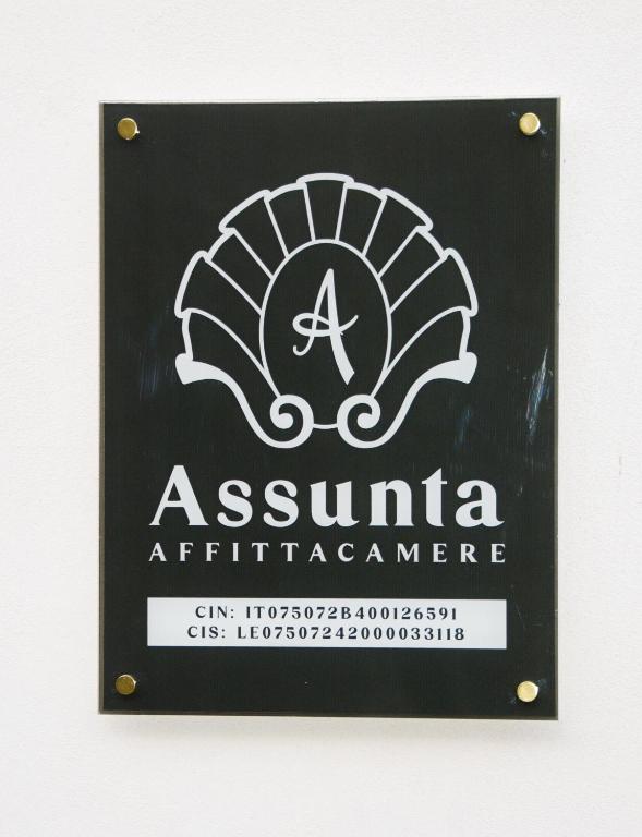 a sign for a restaurant with a armenianarmaarmaarmaarmaarmaarma at Assunta Affittacamere in Vitigliano