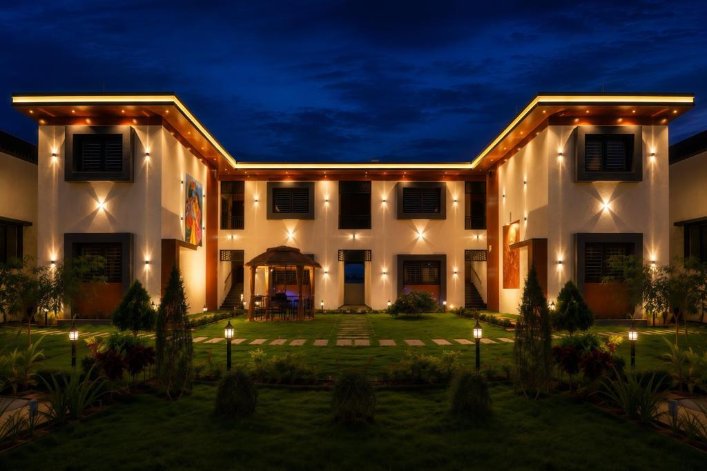 an exterior of a house at night at Temple Town Stay in Kanchipuram