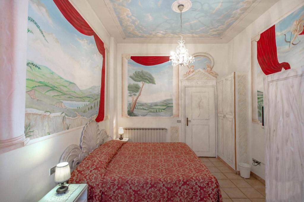 Postel nebo postele na pokoji v ubytování Hotel Masaccio