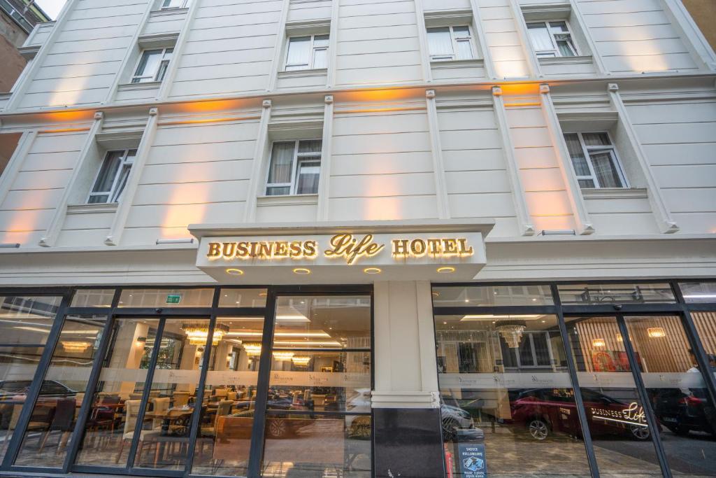 a store front of a building with a sign on it at Business Life Hotel & SPA Bakırköy in Istanbul