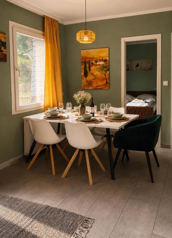 a dining room with a table and chairs at Ferienhaus Drossel am Teutoburgerwald in Lage