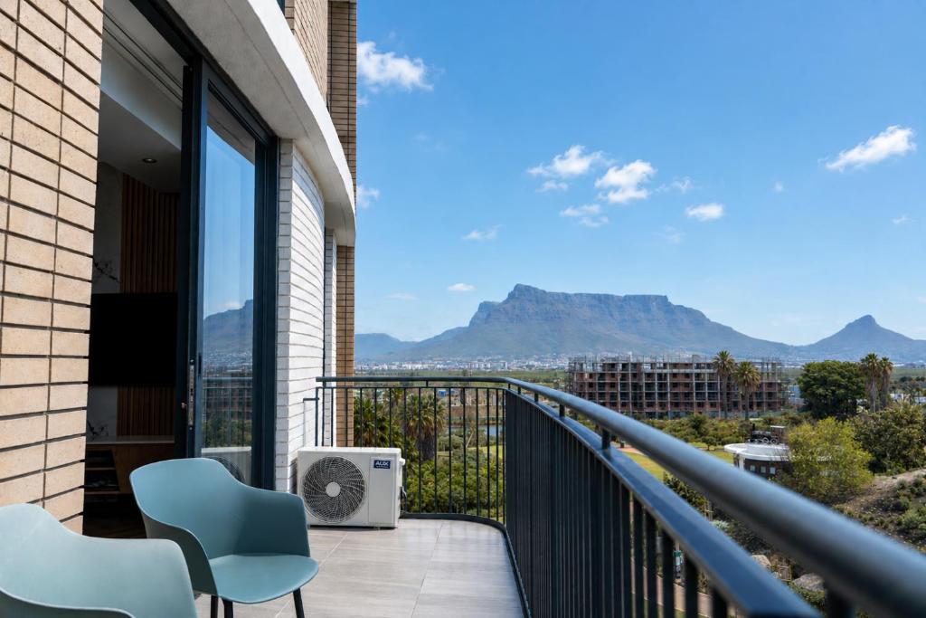 a balcony with a view of the mountains at On Park 516 At Century City in Cape Town