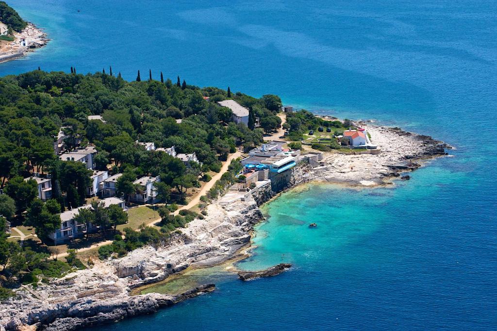 an aerial view of an island in the ocean at Arena Verudela Beach in Pula