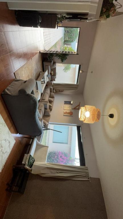 an overhead view of a room with couches and windows at شاليه in Al Bukayriyah
