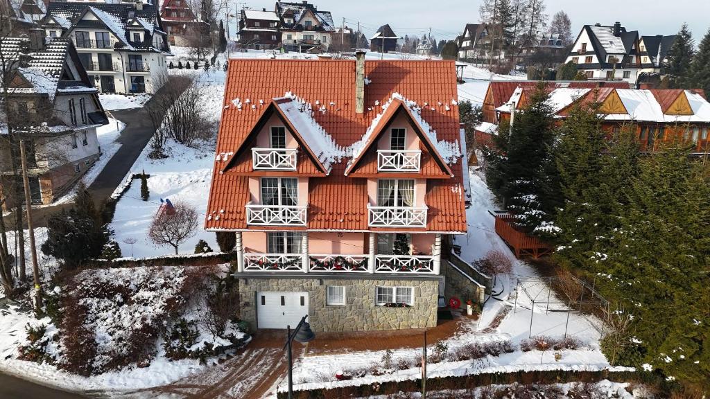 an aerial view of a house with an orange roof at Eleni Pokoje Gościnne in Bukowina Tatrzańska