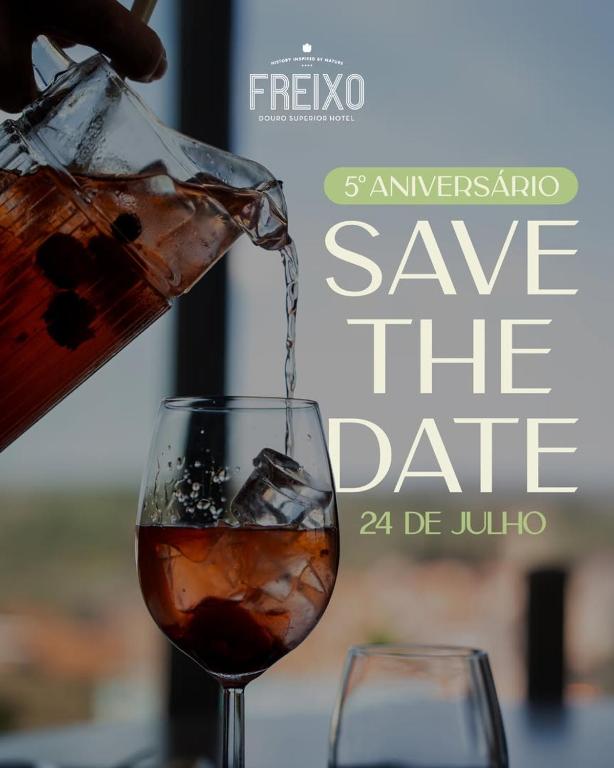 a drink being poured into a wine glass at Hotel Freixo Douro Superior in Freixo de Espada à Cinta
