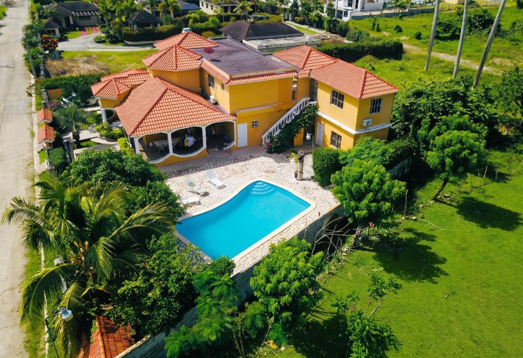 an aerial view of a house with a swimming pool at Elegant Villa in Nagua with Private Pool and Jacuzzi in Nagua
