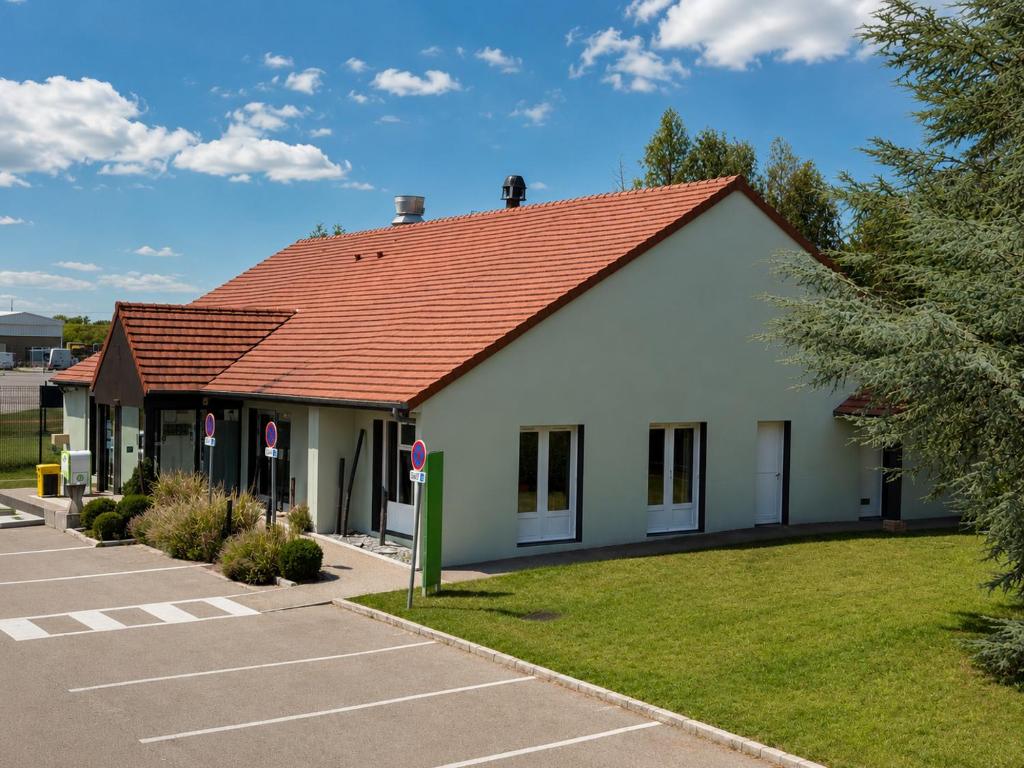 a small white building with a red roof at Campanile Troyes Sud - Buchères in Troyes