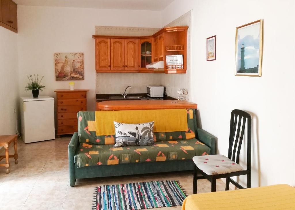a living room with a couch and a kitchen at Exceptional Studio in Frontera | 25 sq.m. | Terrace in Frontera