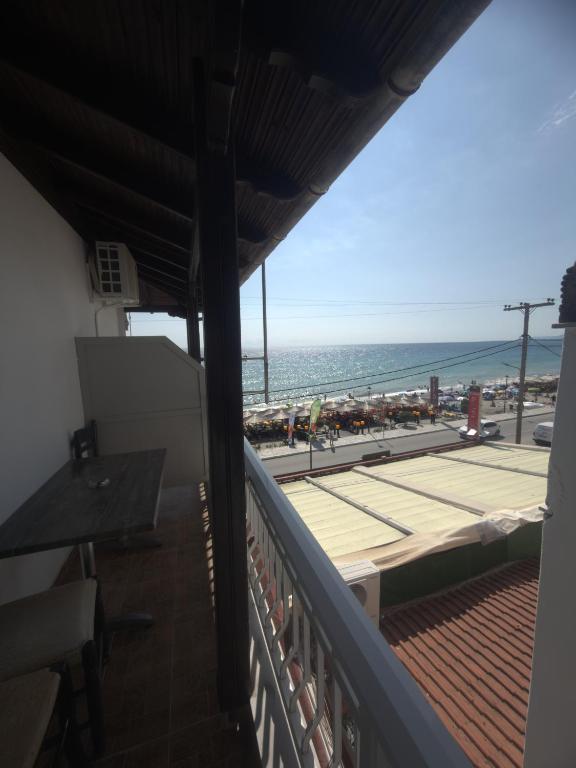 a balcony with a view of the beach at Dafni Seaside Hotel in Leptokarya