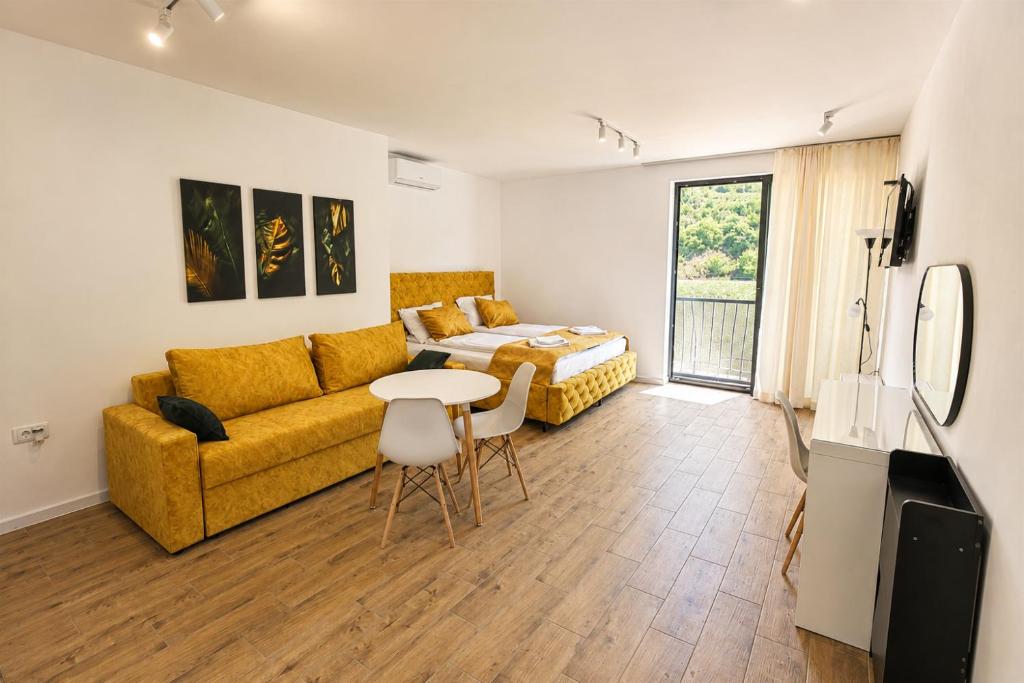 a living room with a couch and a table at Vila Lago Verde in Zvornik