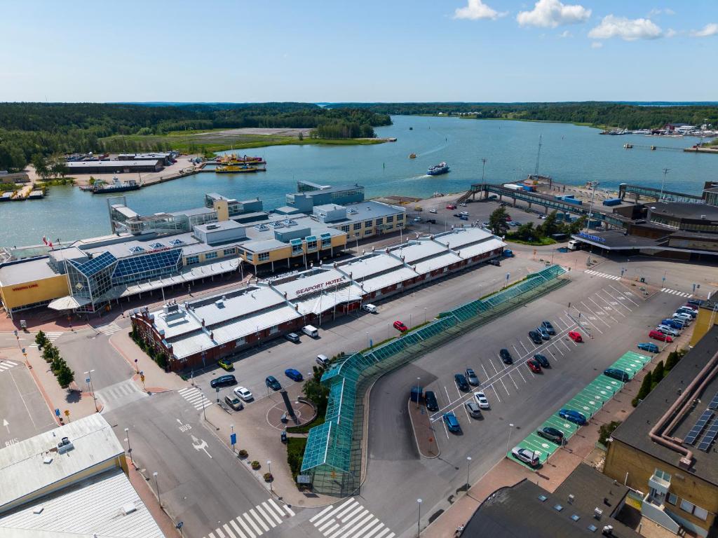 an aerial view of a parking lot next to a river at Hiisi Hotel Turku Seaport in Turku