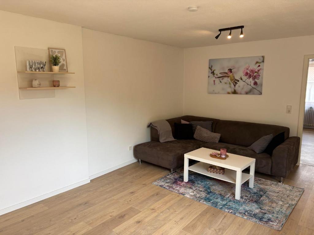a living room with a couch and a table at Ferienwohnung Arend in Nonnweiler