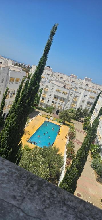 a view of a swimming pool in a large building at Very comfortable apartment in Hajreien