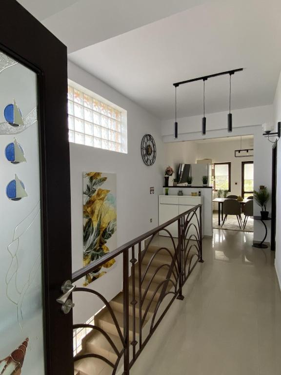 a staircase leading to a kitchen and a living room at Apartament Debres Concept in Aiud