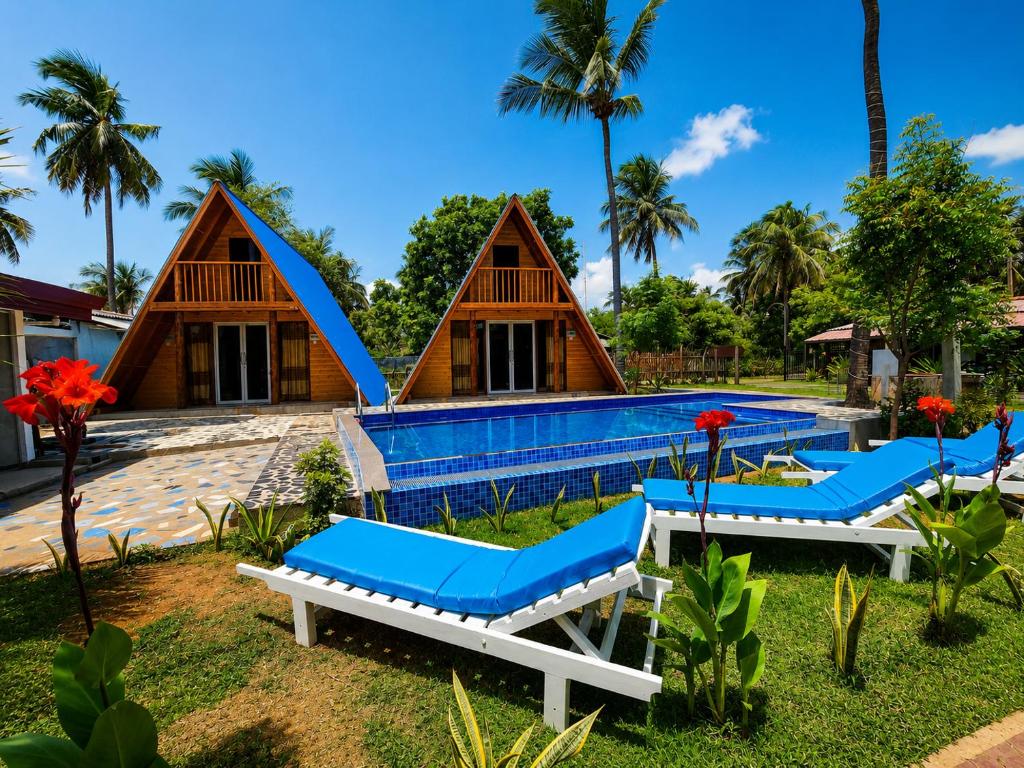 a villa with a pool and a resort at Sheen Coast Beach Cabana in Nilaveli