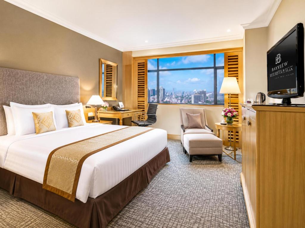 a hotel room with a bed and a television at Hotel Ram krishna Residency in Brahmapur