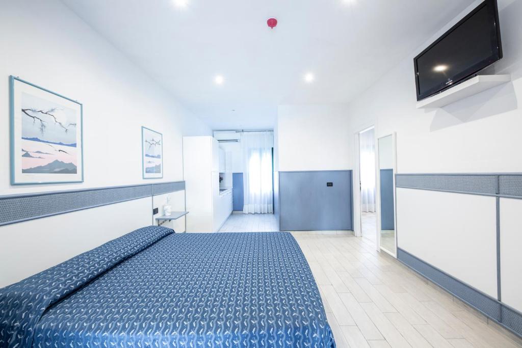 Posteľ alebo postele v izbe v ubytovaní Hotel Olanda