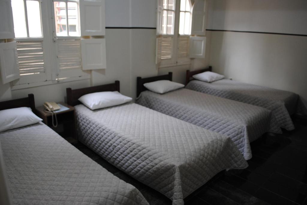 Cama ou camas em um quarto em Sul América Palace Hotel