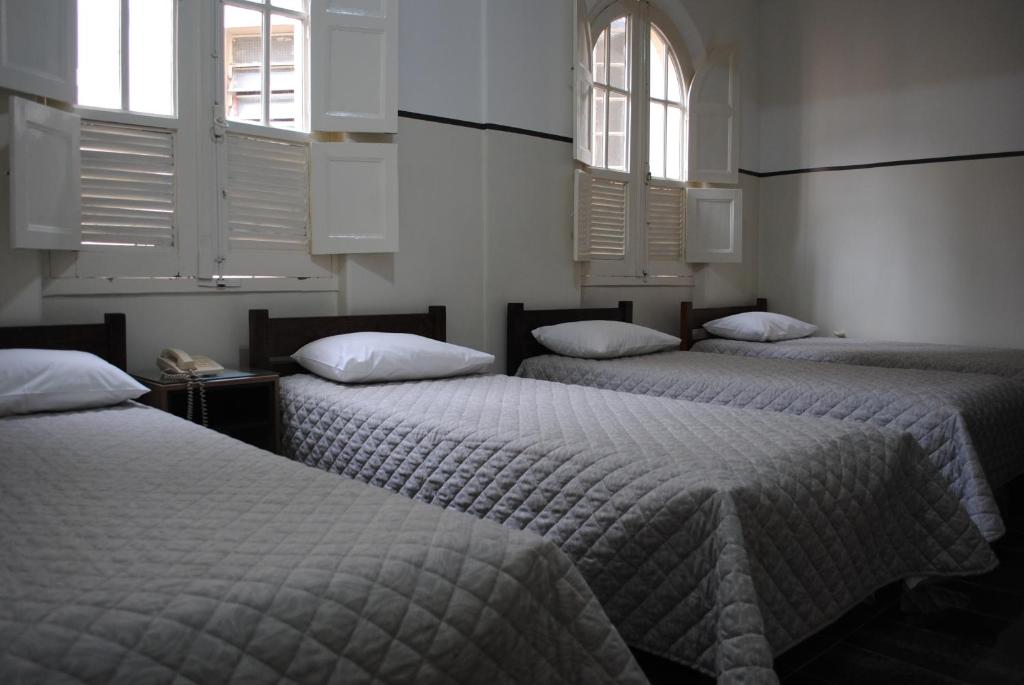 Cama ou camas em um quarto em Sul América Palace Hotel