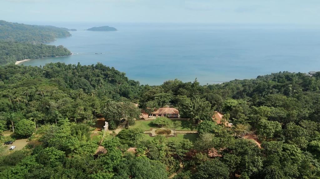 an aerial view of a house on a hill next to a lake at Belo Monte - Principe Collection in Santo António