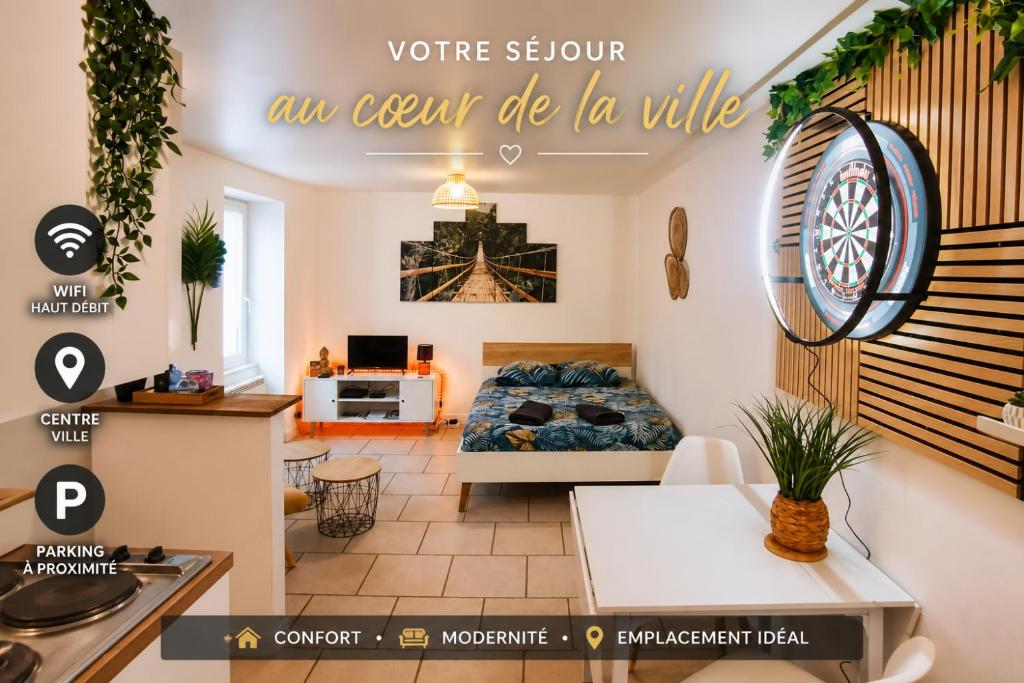 a living room with a bed and a kitchen at studio cosy & fun face aux château fléchettes in Gaillon