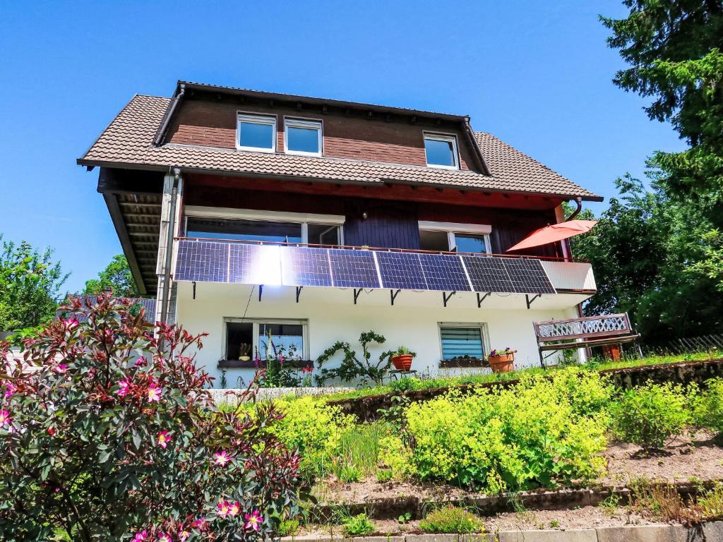 a house with solar panels on it at Apartment Blackforest Birdnest by Interhome in Schonach