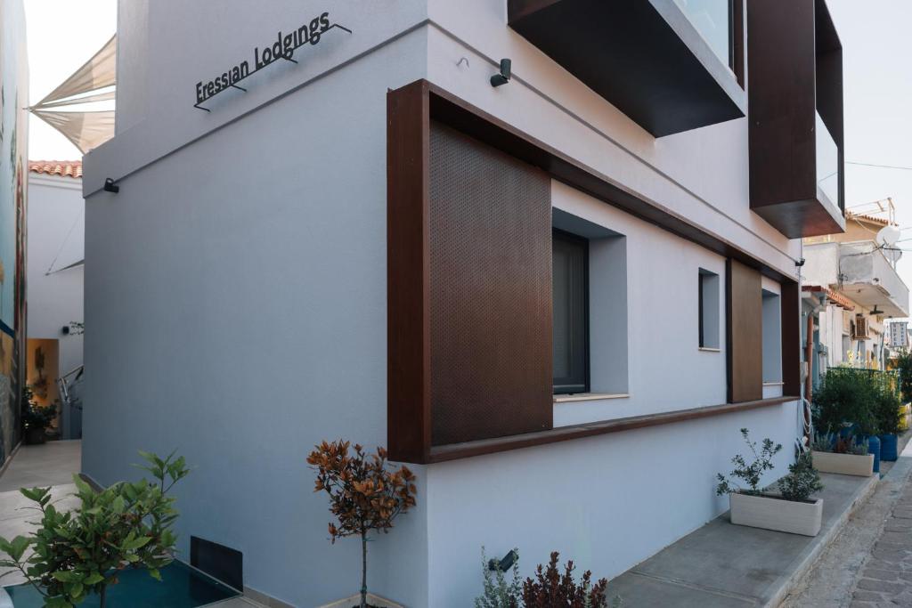 a facade of a house with a window at Eressian Lodgings - Skala Eressos in Skala Eresou