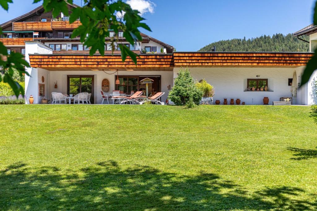 a house with a lawn in front of it at Villa Mona Lisa in Seefeld in Tirol