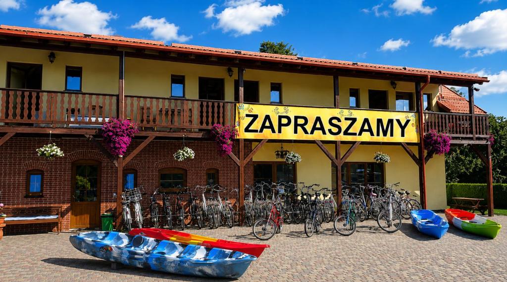 a building with bikes parked in front of it at Gościniec Zośka in Ostrzyce