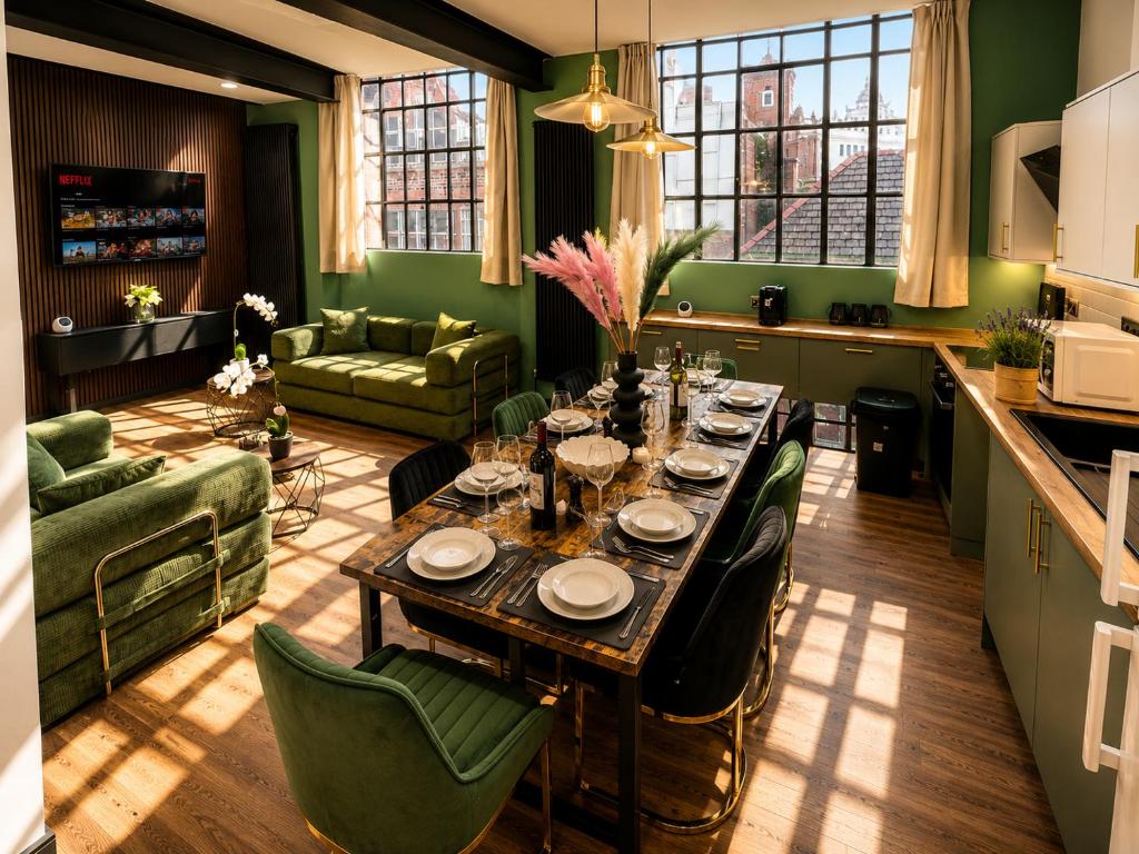 a kitchen and living room with a table and chairs at 2BR Central Apt - Parking -2 Baths - Bars & Trains in Liverpool